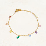 Rainbow pride bracelet featuring droplets with colours from the rainbow pride flag, wide view