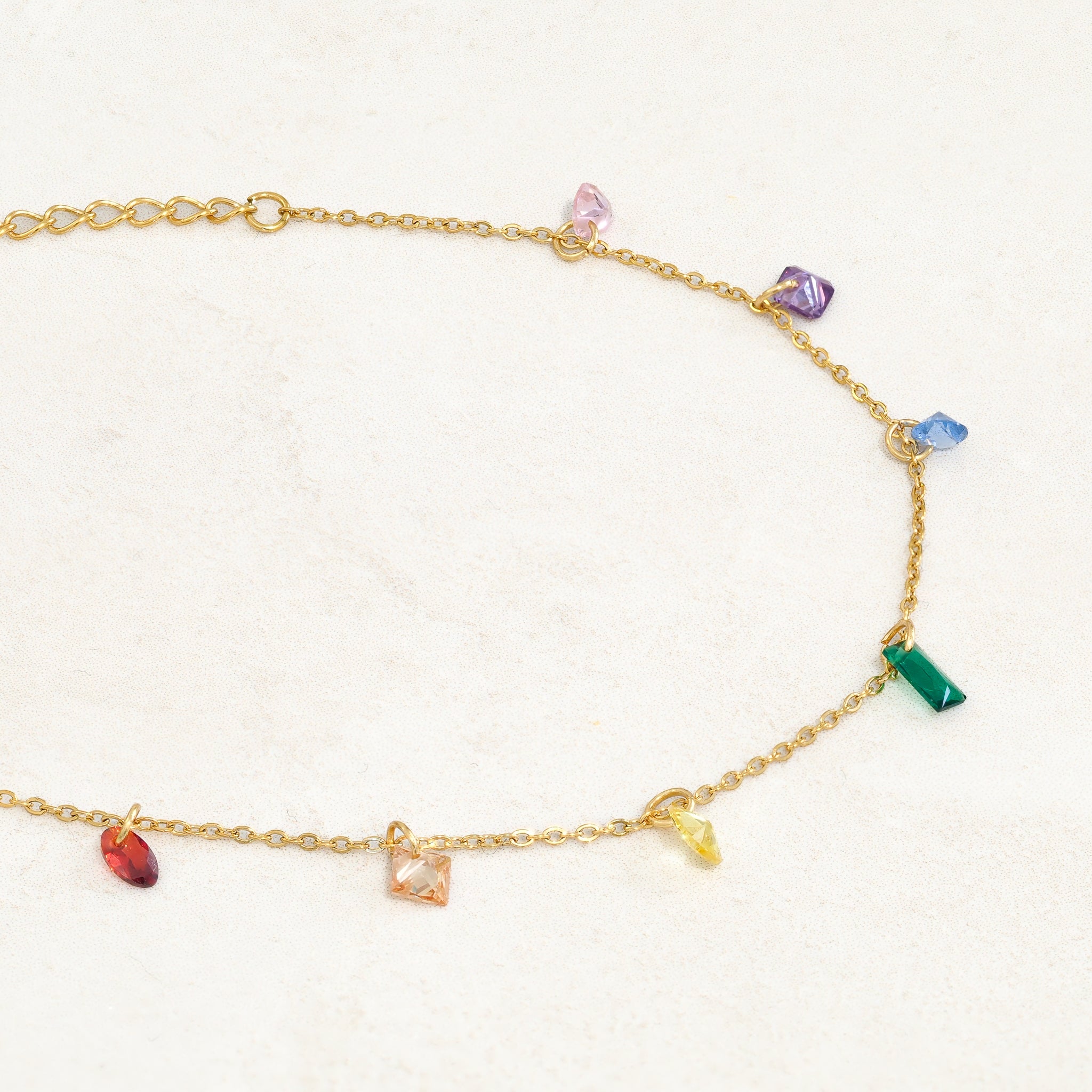 Rainbow pride bracelet featuring droplets with colours from the rainbow pride flag, right side