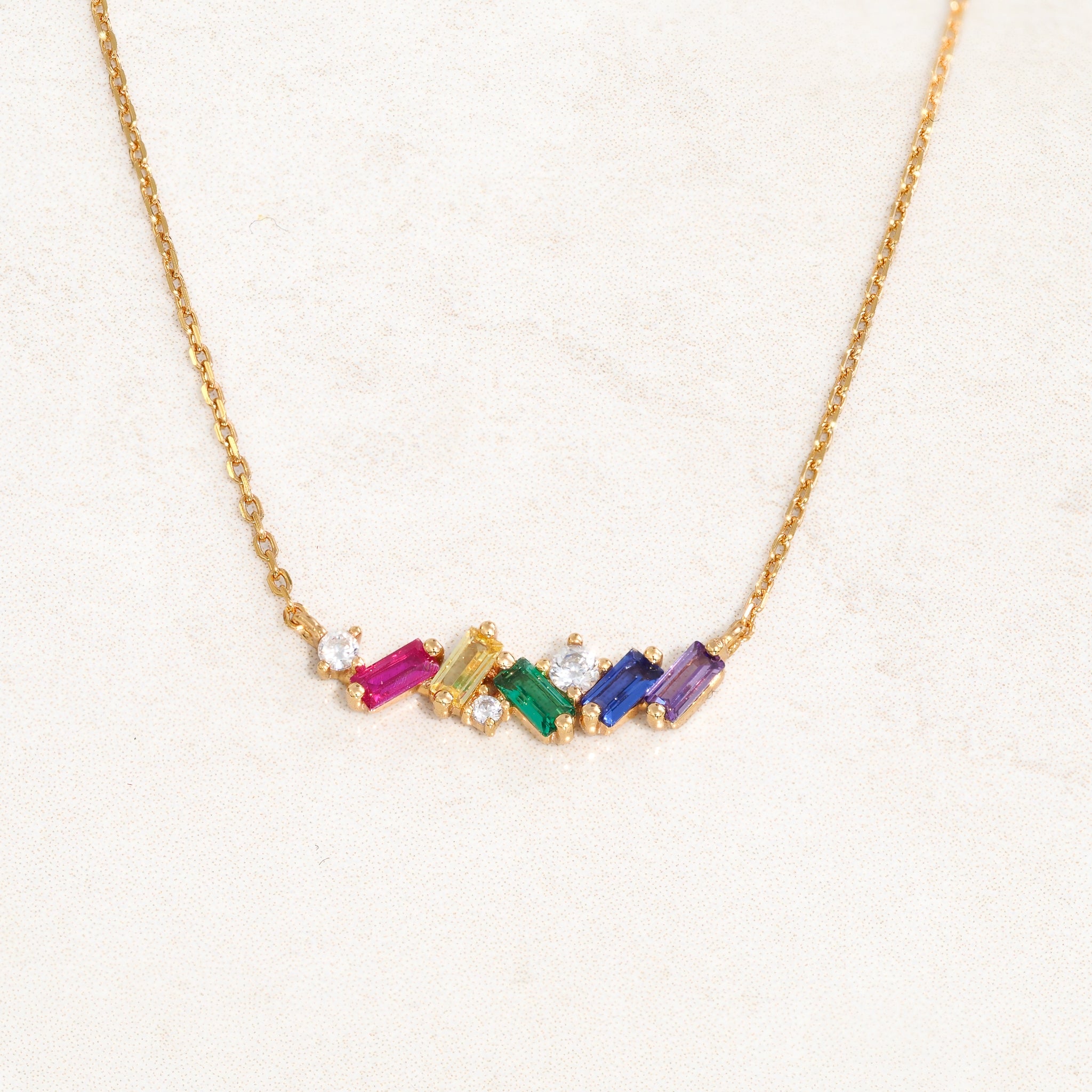 Rainbow Collision Necklace featuring rainbow colours from the LGBT pride flag, close