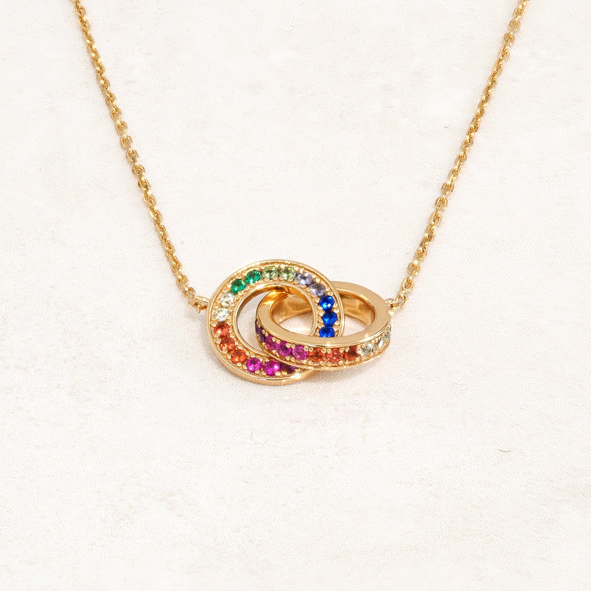 Rainbow Necklace featuring double ring elements and the colours of the rainbow LGBT pride flag, close