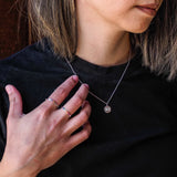Evil eye and rainbow themed necklace as part of pride jewelry collection - model shot