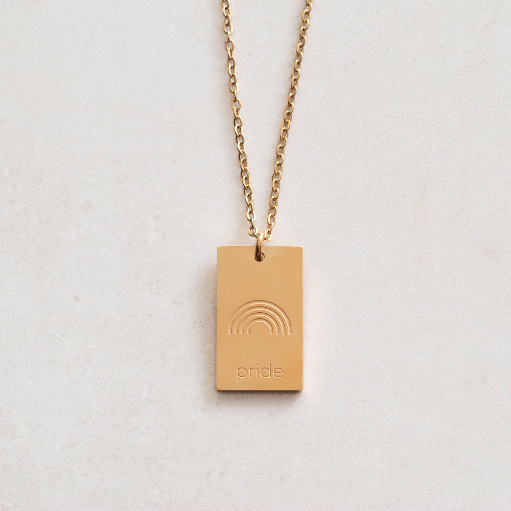 pride tag necklace with rainbow symbol and pride text in pride jewellery collection, gold front