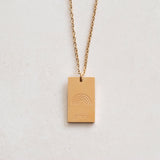 pride tag necklace with rainbow symbol and pride text in pride jewellery collection, gold front