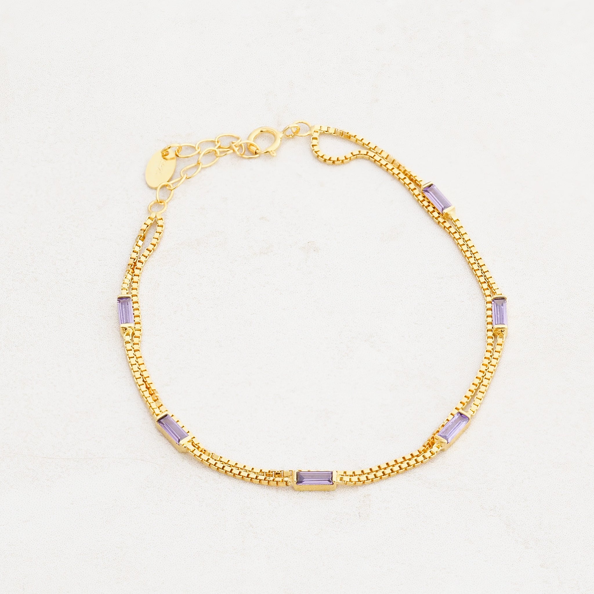 purple and gold bracelet, wear it purple day, pride jewelry, wide shot