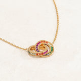 Rainbow Necklace featuring double ring elements and the colours of the rainbow LGBT pride flag, left