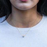pansexual necklace featuring revolve style and pan flag design with pride jewelry on model