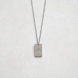 pride tag necklace with rainbow symbol and pride text in pride jewellery collection, silver front